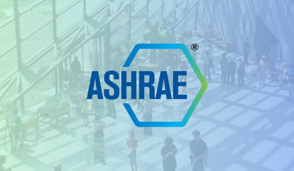 Crowded indoor space with ASHRAE logo, representing efforts toward better indoor air quality.